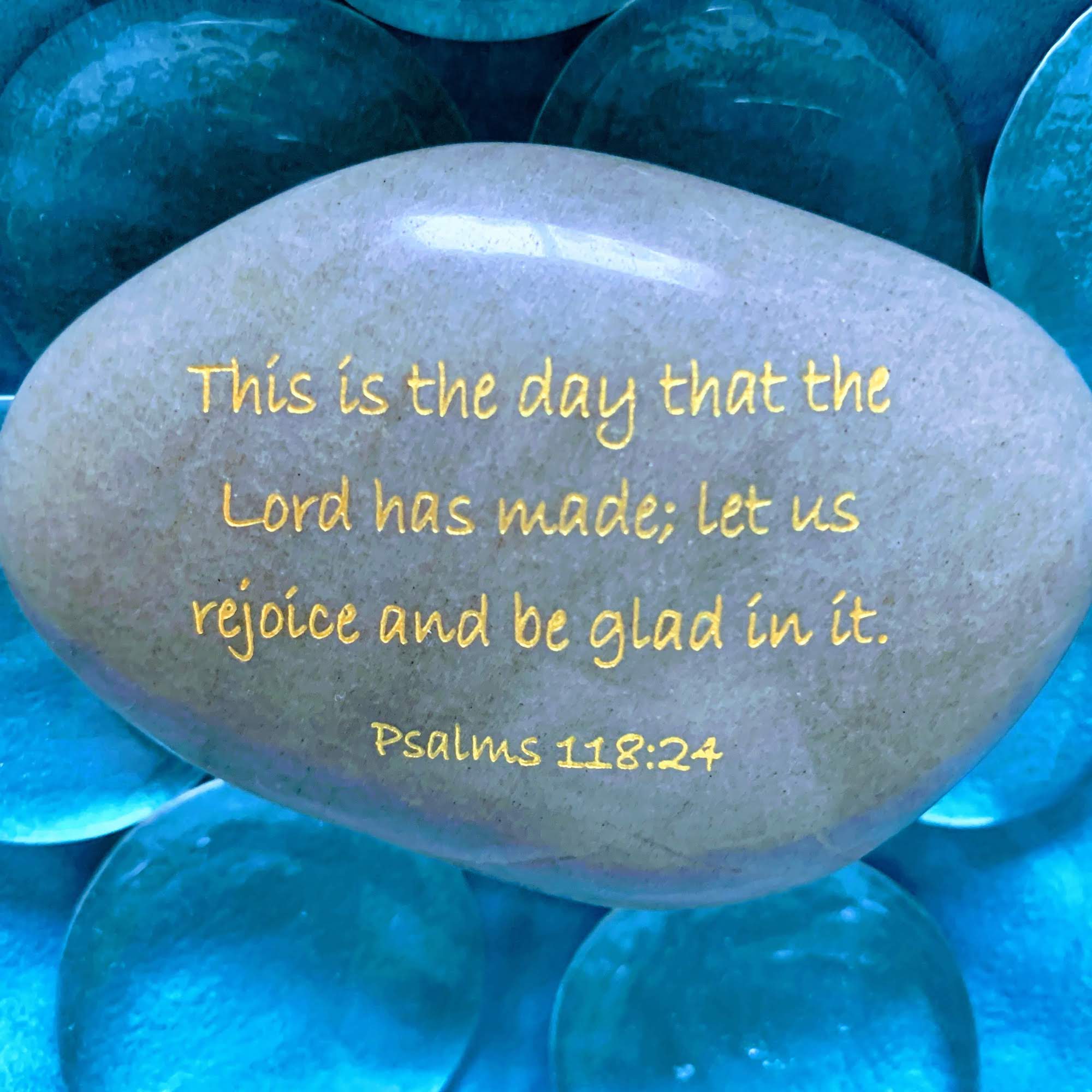 A rock inscribed with the verse: This is the day that the Lord has made. I will rejoice and be glad in it.